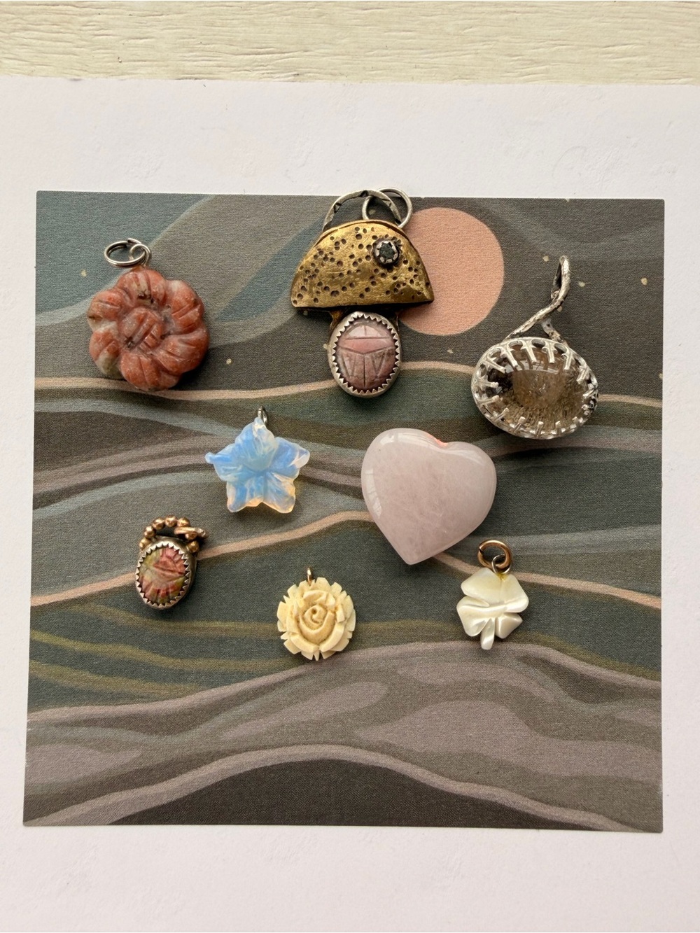 Vintage and handmade whimsical charms, pendants stones.